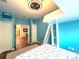 Bedroom with a loft bed with ladder, blue accent wall, and coastal decor at 4540 Turnberry Ln, Lake Wales, FL 33859