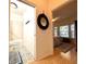 Hallway view of bathroom with decorative flooring and Primary bedroom with natural light at 4540 Turnberry Ln, Lake Wales, FL 33859