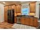 Well-appointed kitchen featuring stainless steel appliances, wood cabinets, and granite countertops at 4540 Turnberry Ln, Lake Wales, FL 33859