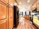 Spacious kitchen with stainless steel appliances, wooden cabinets, and adjacent dining area at 4540 Turnberry Ln, Lake Wales, FL 33859