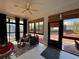 Enclosed patio with furniture, ceiling fan and views of landscaped backyard at 4540 Turnberry Ln, Lake Wales, FL 33859