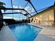 Relaxing screened-in pool area with ample seating for leisure and entertainment at 4540 Turnberry Ln, Lake Wales, FL 33859