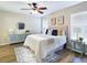 Cozy bedroom with stylish decor and a comfortable bed, complemented by modern furniture and a ceiling fan at 4639 Great Blue Heron Dr, Lakeland, FL 33812