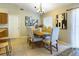 Dining room featuring a wooden table, upholstered chairs, and art at 4639 Great Blue Heron Dr, Lakeland, FL 33812