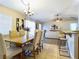 Open concept dining room with elegant furnishings flowing into the living room, perfect for entertaining and everyday living at 4639 Great Blue Heron Dr, Lakeland, FL 33812