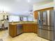 Kitchen featuring stainless steel appliances, open to breakfast and dining rooms at 4639 Great Blue Heron Dr, Lakeland, FL 33812