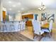 Bright kitchen features breakfast bar with stool seating and a dining area at 4639 Great Blue Heron Dr, Lakeland, FL 33812