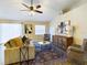Cozy living room with vaulted ceiling, ceiling fan, and comfortable seating area at 4639 Great Blue Heron Dr, Lakeland, FL 33812