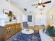 Inviting living room with vaulted ceiling, fan, and a large decorative piece at 4639 Great Blue Heron Dr, Lakeland, FL 33812