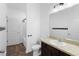 Bathroom features a vanity and shower-tub combo at 4924 Saint James St, Winter Haven, FL 33881