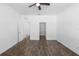 Hardwood floors and a ceiling fan add appeal to this spacious bedroom at 4924 Saint James St, Winter Haven, FL 33881