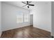 Bedroom with hardwood floors, ceiling fan, and lots of natural light at 4924 Saint James St, Winter Haven, FL 33881