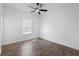 Bright bedroom featuring hardwood floors, a ceiling fan, and natural light at 4924 Saint James St, Winter Haven, FL 33881