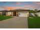 Well-maintained home with lush front lawn and a welcoming driveway at 4924 Saint James St, Winter Haven, FL 33881