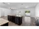 Open-concept kitchen with granite countertops and stainless steel appliances at 4924 Saint James St, Winter Haven, FL 33881