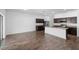 Modern kitchen with stainless steel appliances, granite countertops, and a center island at 4924 Saint James St, Winter Haven, FL 33881
