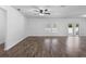 Open-concept living room with hardwood floors and lots of natural light at 4924 Saint James St, Winter Haven, FL 33881