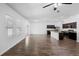 Bright living area with a kitchen view, featuring hardwood floors and natural lighting at 4924 Saint James St, Winter Haven, FL 33881