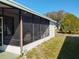 Enclosed back porch with screened windows offers a relaxing outdoor space at 6059 Southern Oaks Se Dr, Winter Haven, FL 33884