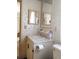 Bathroom featuring a vanity with mirror and an elegant floral wallpaper at 6059 Southern Oaks Se Dr, Winter Haven, FL 33884