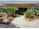 Clubhouse entrance featuring landscaping and water feature at 6059 Southern Oaks Se Dr, Winter Haven, FL 33884