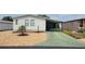 Inviting single-story home with a covered carport and low-maintenance landscaping at 6059 Southern Oaks Se Dr, Winter Haven, FL 33884