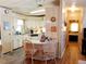 Kitchen, showcasing eat-in counter, ample cabinets and appliances, flowing into dining area at 6059 Southern Oaks Se Dr, Winter Haven, FL 33884
