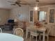 Cozy living room and dining area featuring a ceiling fan and lovely decorative accents at 6059 Southern Oaks Se Dr, Winter Haven, FL 33884