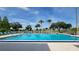 Bright community swimming pool with lounge chairs at 6059 Southern Oaks Se Dr, Winter Haven, FL 33884
