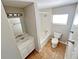 Full bathroom with a tub and shower combination, with white vanity and neutral tile flooring at 618 Chester Dr, Lakeland, FL 33803