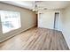 Bright bedroom features wood floors, ceiling fan and built in wardrobe closet at 618 Chester Dr, Lakeland, FL 33803