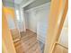 Walk-in closet with closet system and drawers plus wood look flooring at 618 Chester Dr, Lakeland, FL 33803