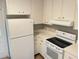 Functional kitchen with white appliances, ample counter space, and classic cabinetry at 618 Chester Dr, Lakeland, FL 33803