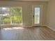 Bright living room featuring a decorative front door and a large window for ample natural light at 618 Chester Dr, Lakeland, FL 33803
