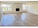 Bright living room featuring a classic fireplace and large windows for ample natural light at 618 Chester Dr, Lakeland, FL 33803