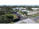 Aerial view of a lovely community, featuring a pool, clubhouse, and palm tree-lined streets at 720 Fonda Ct # 54, Lakeland, FL 33803