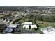 An aerial view of a tranquil residential area, featuring well-maintained homes surrounded by lush greenery and mature trees at 720 Fonda Ct # 54, Lakeland, FL 33803