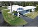 A lovely aerial view showcasing the property, with well-kept lawns, and white-tiled roofs in a peaceful community at 720 Fonda Ct # 54, Lakeland, FL 33803