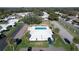 An aerial showcasing a community with a pool, shuffleboard courts, and mature trees at 720 Fonda Ct # 54, Lakeland, FL 33803