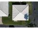 A stunning aerial view of a home featuring a white roof and lush green lawn at 720 Fonda Ct # 54, Lakeland, FL 33803