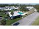 Aerial of a well-maintained community, featuring a pool, clubhouse, and lush lawns at 720 Fonda Ct # 54, Lakeland, FL 33803