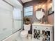 Stylish bathroom with a glass bowl sink, ornate mirror, and shower-tub combo provides a spa-like experience at 720 Fonda Ct # 54, Lakeland, FL 33803