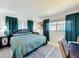 Inviting bedroom with a plush bed, beach-themed art, and natural light creates a cozy, relaxed atmosphere at 720 Fonda Ct # 54, Lakeland, FL 33803