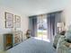 Bright bedroom with a sliding door access to the outdoors and tasteful decor for a tranquil living space at 720 Fonda Ct # 54, Lakeland, FL 33803