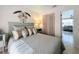 Serene bedroom featuring a comfortable bed, neutral tones, and decorative accents for a peaceful retreat at 720 Fonda Ct # 54, Lakeland, FL 33803