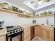 Functional kitchen with butcher block countertops, open shelving, and stainless steel appliances at 720 Fonda Ct # 54, Lakeland, FL 33803