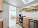 Charming kitchen features a stainless steel oven and dining space visible through an open doorway at 720 Fonda Ct # 54, Lakeland, FL 33803