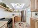 Well-organized kitchen with butcher block counters, stainless steel appliances, and open shelving at 720 Fonda Ct # 54, Lakeland, FL 33803