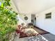 Charming covered patio with comfortable seating, perfect for relaxation and enjoying the outdoor ambiance at 720 Fonda Ct # 54, Lakeland, FL 33803