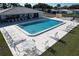 Overhead shot of a inviting community pool showcasing its shimmering water, and providing a refreshing and relaxing retreat at 720 Fonda Ct # 54, Lakeland, FL 33803